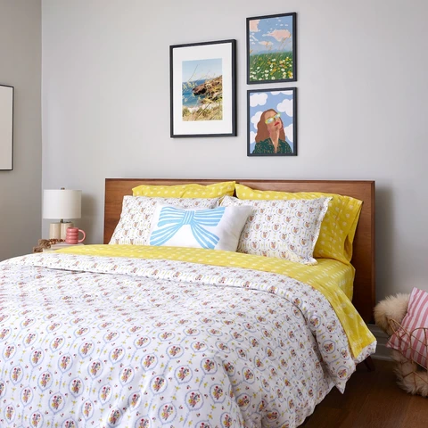 Layered bedding and home decor for anniversaries